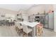 Modern kitchen with gray cabinets, a large island, and stainless steel appliances at 4736 Se 34Th St, Ocala, FL 34480