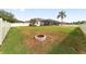 Landscaped backyard featuring a fire pit, ideal for gatherings and relaxation at 4736 Se 34Th St, Ocala, FL 34480