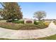 The Manor community entrance with landscaping and a curved sidewalk at 4736 Se 34Th St, Ocala, FL 34480
