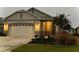 Two-story home with white garage door and gray siding at 8754 Sw 76Th Street Rd, Ocala, FL 34481