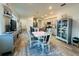 Open concept kitchen with island, stainless steel appliances, and light gray cabinets at 8754 Sw 76Th Street Rd, Ocala, FL 34481