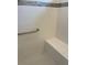 Clean shower with tiled walls and a built-in seat at 10201 Sw 96Th Loop, Ocala, FL 34481