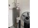Water heater and fan located in garage or utility area at 10201 Sw 96Th Loop, Ocala, FL 34481