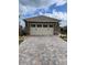 Two-car garage with paver driveway at 10201 Sw 96Th Loop, Ocala, FL 34481