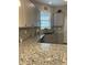 Kitchen boasts granite countertops and stylish backsplash at 10201 Sw 96Th Loop, Ocala, FL 34481