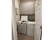 Convenient laundry room with washer, dryer, and upper cabinets at 10201 Sw 96Th Loop, Ocala, FL 34481