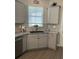 Modern kitchen with granite counters and ample cabinetry at 10201 Sw 96Th Loop, Ocala, FL 34481
