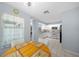 Kitchen with granite countertops, white cabinets and view into living room at 17789 Se 113Th Ter, Summerfield, FL 34491