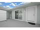 White door and sliding glass door access to the patio at 17789 Se 113Th Ter, Summerfield, FL 34491