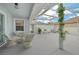 Covered patio with seating area, perfect for outdoor dining at 17789 Se 113Th Ter, Summerfield, FL 34491