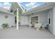 Spacious patio features a seating area and access to the front door at 17789 Se 113Th Ter, Summerfield, FL 34491