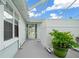 Private patio with covered lanai and lush landscaping at 17789 Se 113Th Ter, Summerfield, FL 34491