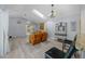 Spacious living room featuring leather furniture and a view of the backyard at 17789 Se 113Th Ter, Summerfield, FL 34491