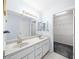 Clean bathroom with double sinks and a large closet at 17789 Se 113Th Ter, Summerfield, FL 34491