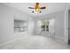 Bright bedroom with tile floors, window, and ceiling fan at 17789 Se 113Th Ter, Summerfield, FL 34491
