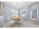 Small breakfast nook with round table and chairs, adjacent to kitchen at 17789 Se 113Th Ter, Summerfield, FL 34491