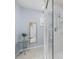 Bathroom with a large mirror and walk-in shower at 17789 Se 113Th Ter, Summerfield, FL 34491