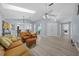 Bright living room with hardwood floors and access to other rooms at 17789 Se 113Th Ter, Summerfield, FL 34491