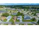 Aerial view showcasing a home, neighborhood, and a nearby lake at 17789 Se 113Th Ter, Summerfield, FL 34491