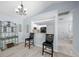 Bright dining area with light flooring and a view into the kitchen at 17789 Se 113Th Ter, Summerfield, FL 34491