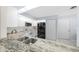 Kitchen with granite countertops, double sink, and stainless steel appliances at 17789 Se 113Th Ter, Summerfield, FL 34491