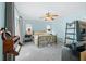 Comfortable main bedroom with a ceiling fan and plenty of natural light at 17789 Se 113Th Ter, Summerfield, FL 34491