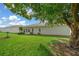 Spacious backyard with lush lawn and mature shade tree at 17789 Se 113Th Ter, Summerfield, FL 34491