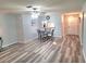 Dining area with glass table, chairs, and wood-look floors at 4961 Sw 196Th Ave, Dunnellon, FL 34431