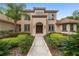 Two-story house with a walkway leading to the front door at 678 Se 47Th Loop, Ocala, FL 34480