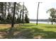 Backyard with lake view, playground, picnic table and kayaks at 727 Ne 130Th Ter, Silver Springs, FL 34488