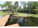 Wooden dock offering lake access, with kayaks and canoes available at 727 Ne 130Th Ter, Silver Springs, FL 34488
