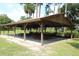 Outdoor community pavilion with picnic tables, perfect for gatherings at 727 Ne 130Th Ter, Silver Springs, FL 34488