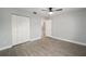 Bright bedroom with large closet and wood-look flooring at 8891 Sw 96Th Ln # B, Ocala, FL 34481