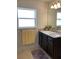 Bathroom with single sink vanity and shower/tub combo at 9115 Sw 49Th Ct, Ocala, FL 34476