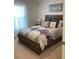 Bedroom with a queen-size bed and purple bedding at 9115 Sw 49Th Ct, Ocala, FL 34476