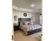Large main bedroom with a comfortable bed and stylish decor at 9115 Sw 49Th Ct, Ocala, FL 34476