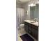 Bathroom with double sinks and granite countertops at 9115 Sw 49Th Ct, Ocala, FL 34476