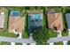 Aerial view showcasing three homes with pools at 11700 Sw 72Nd Cir, Ocala, FL 34476