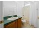 Bathroom with tub shower and wood vanity at 11700 Sw 72Nd Cir, Ocala, FL 34476