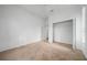 Spacious bedroom with walk-in closet and carpet flooring at 11700 Sw 72Nd Cir, Ocala, FL 34476