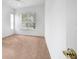 Bright bedroom with carpet flooring and large window at 11700 Sw 72Nd Cir, Ocala, FL 34476