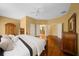 Main bedroom with hardwood floors and access to bathroom at 11700 Sw 72Nd Cir, Ocala, FL 34476