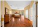 Main bedroom with hardwood floors and access to backyard at 11700 Sw 72Nd Cir, Ocala, FL 34476