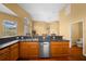 Kitchen features stainless steel dishwasher and ample counter space at 11700 Sw 72Nd Cir, Ocala, FL 34476