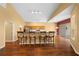Kitchen with breakfast bar, wood cabinets, and hardwood floors at 11700 Sw 72Nd Cir, Ocala, FL 34476