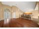 Open living and kitchen area with hardwood floors at 11700 Sw 72Nd Cir, Ocala, FL 34476