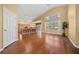 Spacious living area with hardwood floors and kitchen views at 11700 Sw 72Nd Cir, Ocala, FL 34476
