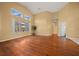 Bright living room with hardwood floors and vaulted ceiling at 11700 Sw 72Nd Cir, Ocala, FL 34476