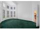 Home office with bay window and green carpet at 11700 Sw 72Nd Cir, Ocala, FL 34476