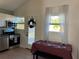 Kitchen dining area with a table set for four at 5611 Berts Rd, Lady Lake, FL 32159